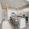 New kitchen with white cabinets and quartz countertops