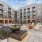 Luxury resort pool with cabanas and outdoor dining areas and fire pit 