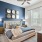 a bedroom with a bed and a fan