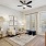 Living room with desk area and ceiling fan